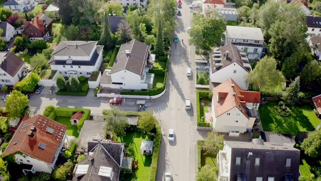 Beautiful view of buildings with green trees and road in the city of Munich, Germany