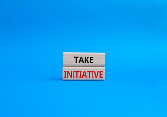 Take initiative symbol. Wooden blocks with words Take initiative. Beautiful blue background. Business and Take initiative concept. Copy space.