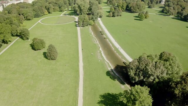 Beautiful view of park with trees and buildings in the city of Munich, Germany