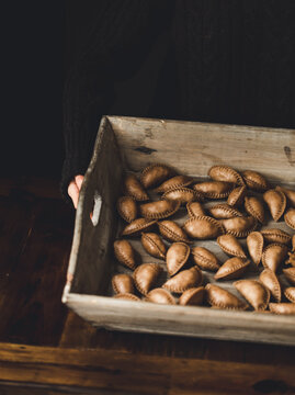 Pile of pierogies in wooden box