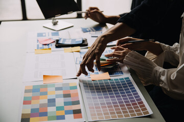 Close up ux developer and ui designer use augmented reality brainstorming about mobile app...