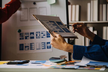 Close up ux developer and ui designer use augmented reality brainstorming about mobile app...