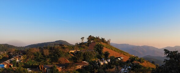 Village viewpoint from top mountain in Northern Thailand, blue sky, season, travel, nature, tree, green, cloud  - Powered by Adobe