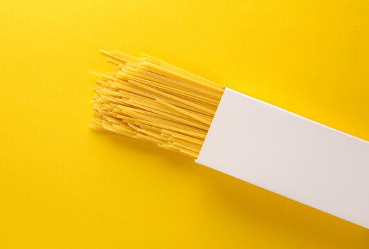 White box mockup of italian pasta on yellow background. Template for design