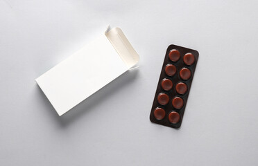 Pill blister mockup with blank cardboard box packaging on gray background. Template for design