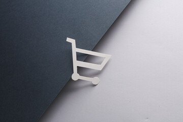 Shopping trolley on black gray background. Sale, creative layout