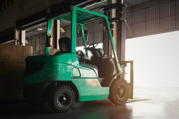 Fototapeta na wymiar Forklift Tractor Parked in Warehouse. Forklift Loader. Shipping Warehouse Logistics.