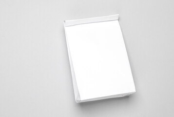 White paper lunch bag mockup on gray background. Template for design