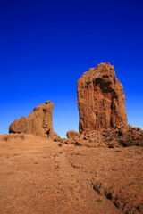 Fototapeta premium Hiker standing near Roque Nublo, Gran Canaria, Canary Islands, Spain.