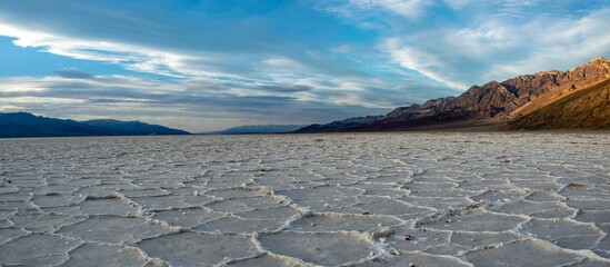 Panoramic top view of the saltflats in the Death Valley under blue cloudy sky in California