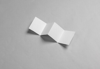 White paper brochure mockup on gray background