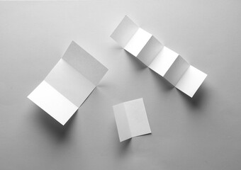 White mock up paper brochures on gray background