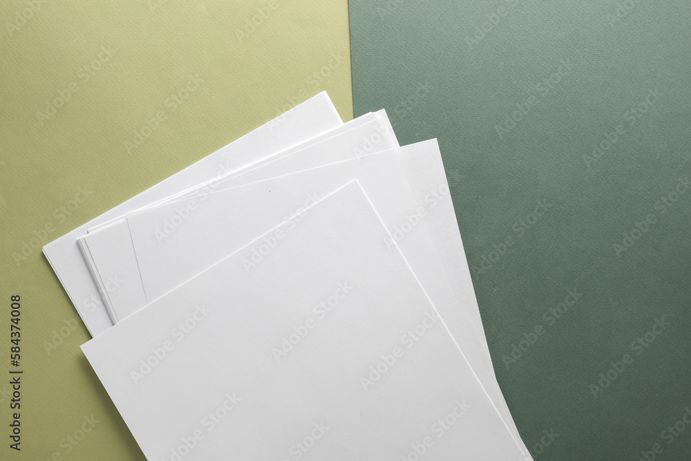 Poster white blank sheets of a4 paper size or documents mockup on green background. template for design
