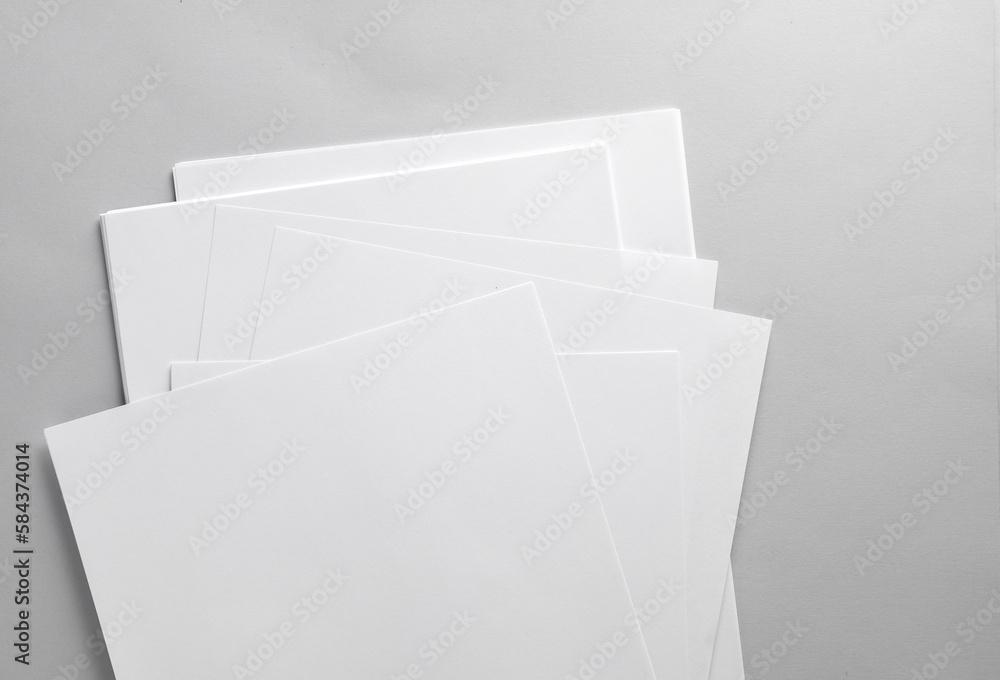 Aufkleber white blank sheets of a4 paper size or documents mockup on gray background. template for design