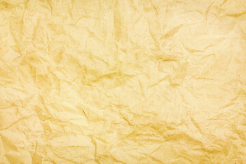 Yellow stained paper. Old retro letter texture. Parchment paper background. Secret letter backdrop. Crumpled paper. Wrinkled page.