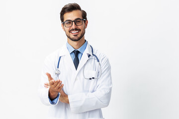 Fototapeta premium Man portrait of a doctor wearing a white coat and eyeglasses and a stethoscope looking into the camera on a white isolated background, copy space, space for text, health