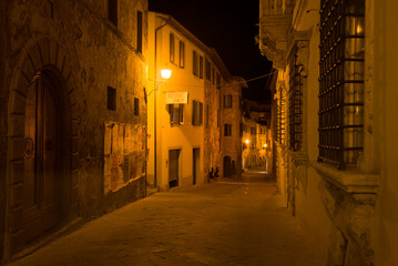 Fototapeta na wymiar Night street of the ancient city. Montepulciano, Italy