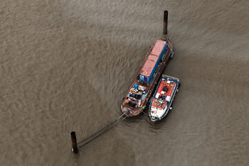 Moored boats at Thames river, London. Aerial photo