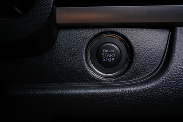 The dashboard shows details of the start button in the car. engine start and stop button. A car engine that starts and stops with the push of a button.