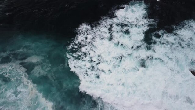 White Frothy Ocean Waves Rushing Over Rugged Coastline In Caion Beach, Coruna Spain. Aerial Drone Shot