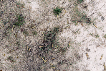 Top view of a large number of spent cartridge case from a Kalashnikov assault rifle.
