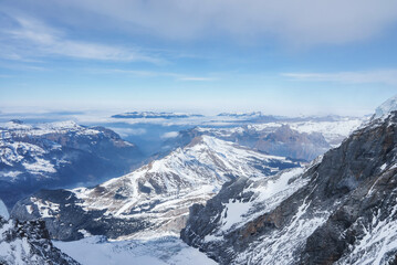Magica view of the Alps mountains in Switzerland. View from helicopter in Swiss Alps. Mountain tops in snow. Breathtaking view of Jungfraujoch and the UNESCO World Heritage - the Aletsch Glacier