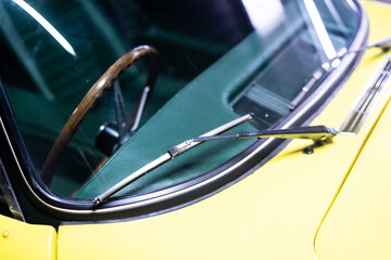 Wiper blades on a yellow vintage car 