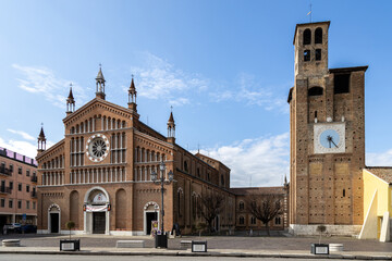 View of Cathedral of Piove di Sacco and Carrarese Tower; Piove di Sacco, Veneto, Italy  - obrazy, fototapety, plakaty