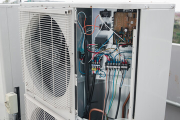 Technician is checking air conditioner,measuring equipment for filling air conditioners.