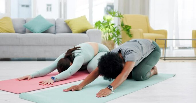 Friends, child pose and yoga of women in home for stretching, wellness and health. Fitness stretch, pilates yogi and girls exercising, training and workout together for holistic exercise in house.