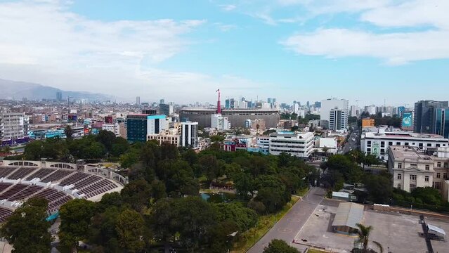Video of the National Stadium of Lima along with the cityscape of the city. Video from a drone.