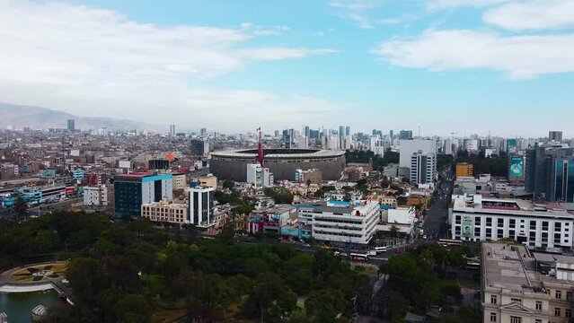 Video of the National Stadium of Lima along with the cityscape of the city. Video from a drone.