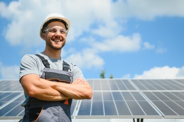 Worker installing solar panels outdoors