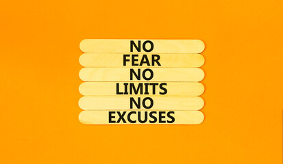 No fear limits excuses symbol. Concept words No fear no limits no excuses on wooden stick. Beautiful orange table orange background. Business not fear limits excuses concept. Copy space.