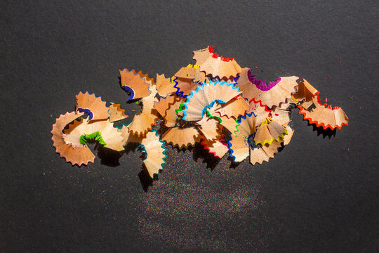 Pencil Shavings Isolated On A Black Background. Top View, Flat Lay.