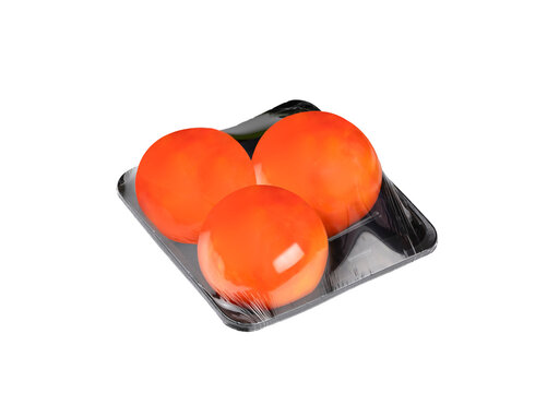 Tomatoes in black package tray with plastic wrapping isolated on transparent background, png file 