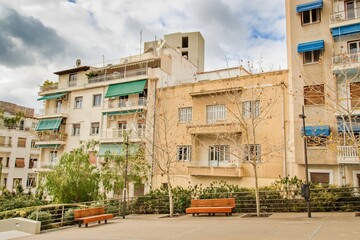 Naklejka premium Typical street in city Athens without poeple during cloudy day