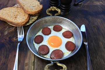 Turkish breakfast food, sahanda sucuklu yumurta , Turkish omelette with sucuk, tea and bread