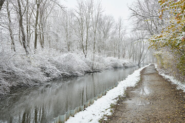 A canal with a trail in the winter