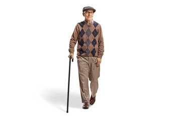 Full length portrait of an elderly man with a cane walking towards camera