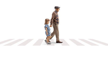 Full length profile shot of a grandfather crossing street with a child