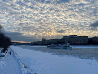 Strong minus in Moscow.
View of the frozen Moskva River, ship and houses in the Khamovniki district...