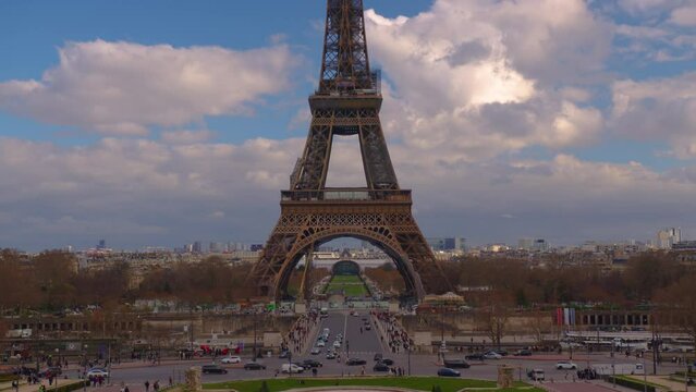 Famous square Trocadero with Eiffel tower in the background time lapse. Trocadero and Eiffel tower are the most visited attractions of Paris. Blue cloudy sky on background. Area after restoration