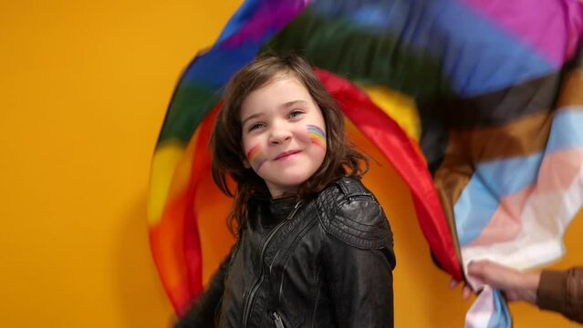 adorable girl waves lgbt flag