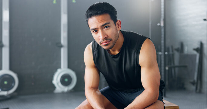 Gym, Sports Man And Fitness Training By Man Serious About Health, Wellness And Competitive Mindset. Face, Portrait And Asian Instructor Sitting Before Workout, Exercise And Cardio Exercises In Japan