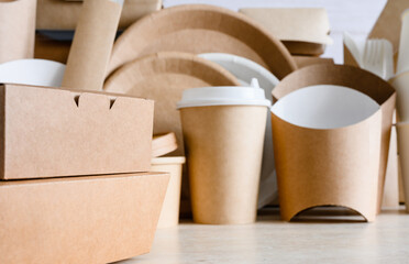 Close-up of paper disposable food containers. Eco-friendly biodegradable food packaging. Selective focus on the container in the foreground.