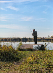 man fishing on the river