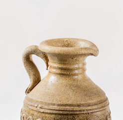 Top of earthenware jug for wine isolated on white background