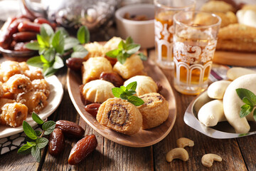Obraz na płótnie Canvas Ramadan food- pastry, dried dates and mint tea