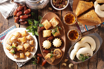 Ramadan food- assorted of pastry,  dried dates and mint tea